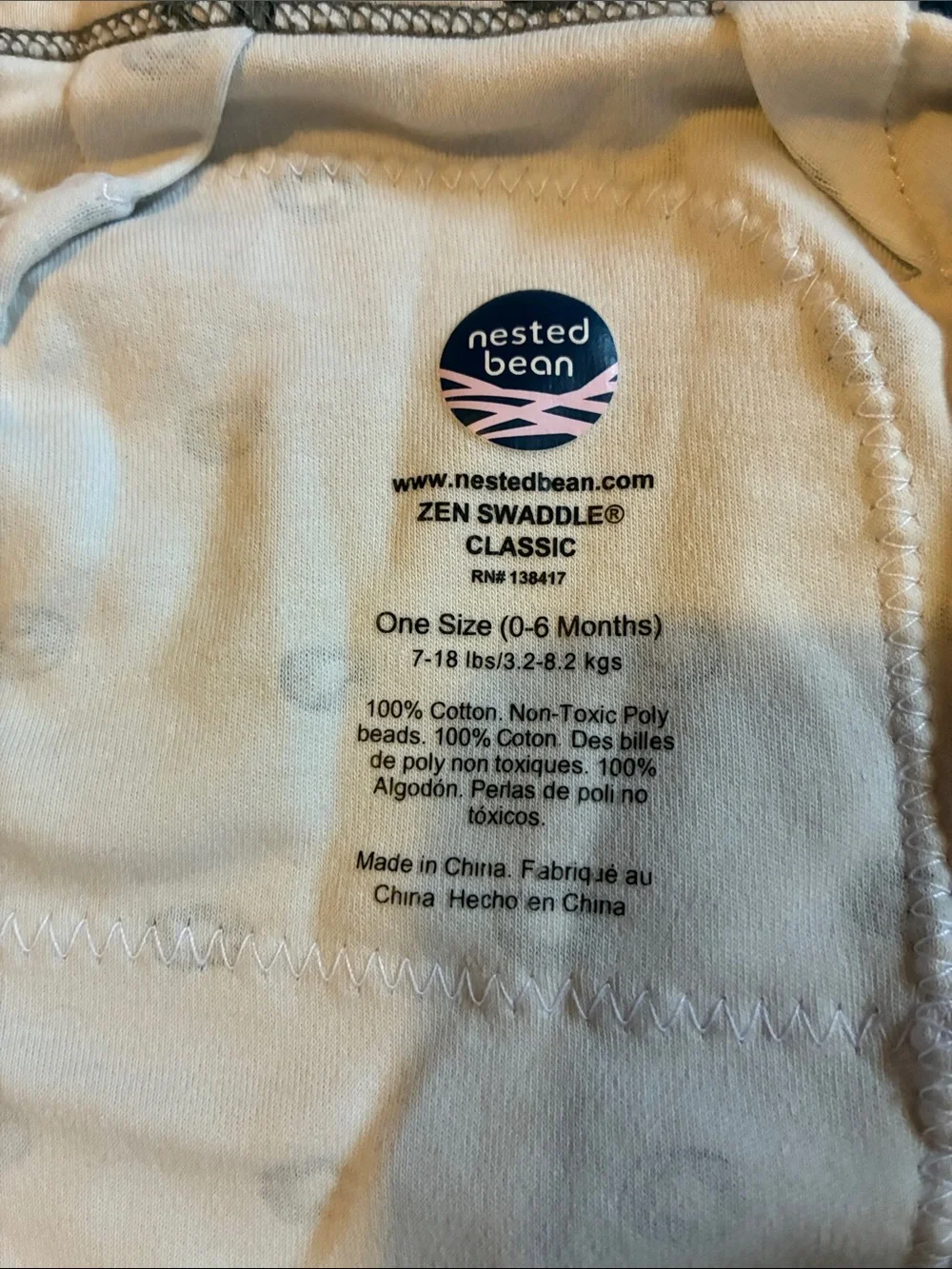 Nested Bean Cream Swaddle with Black Dot Accent